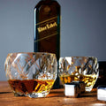Elegant Diamond Shaped Crystal Whiskey Glass with whiskey and bottle