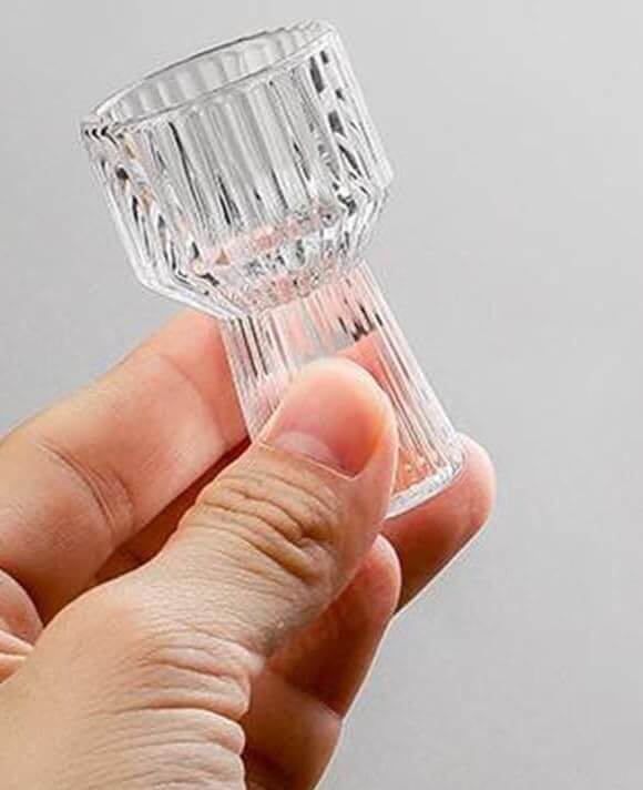 Hand showcasing detailed Mini Measure Shot Glass design