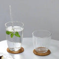 Tabletop setup with mint water and Retro Striped Glass Cup