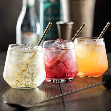 Crystal Oval Shape Whiskey Glass with cocktails on a rustic table.