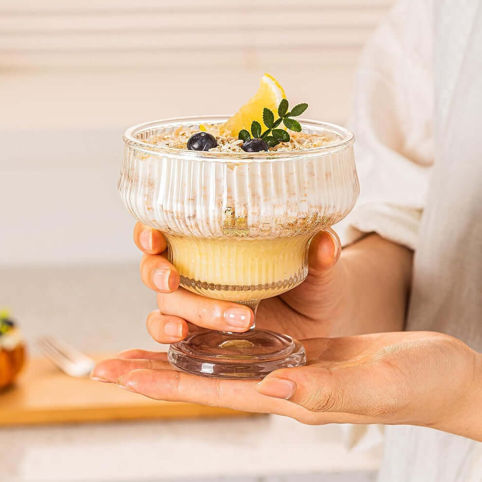 Chilled pudding in a sundae bowl with fruit garnish