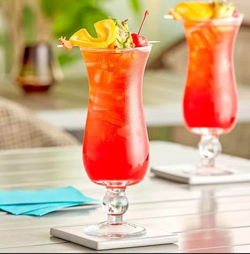 Hurricane Drinking Glass with a vibrant red cocktail