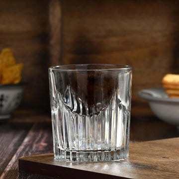 Molded Design Whiskey Glass placed on rustic wooden board
