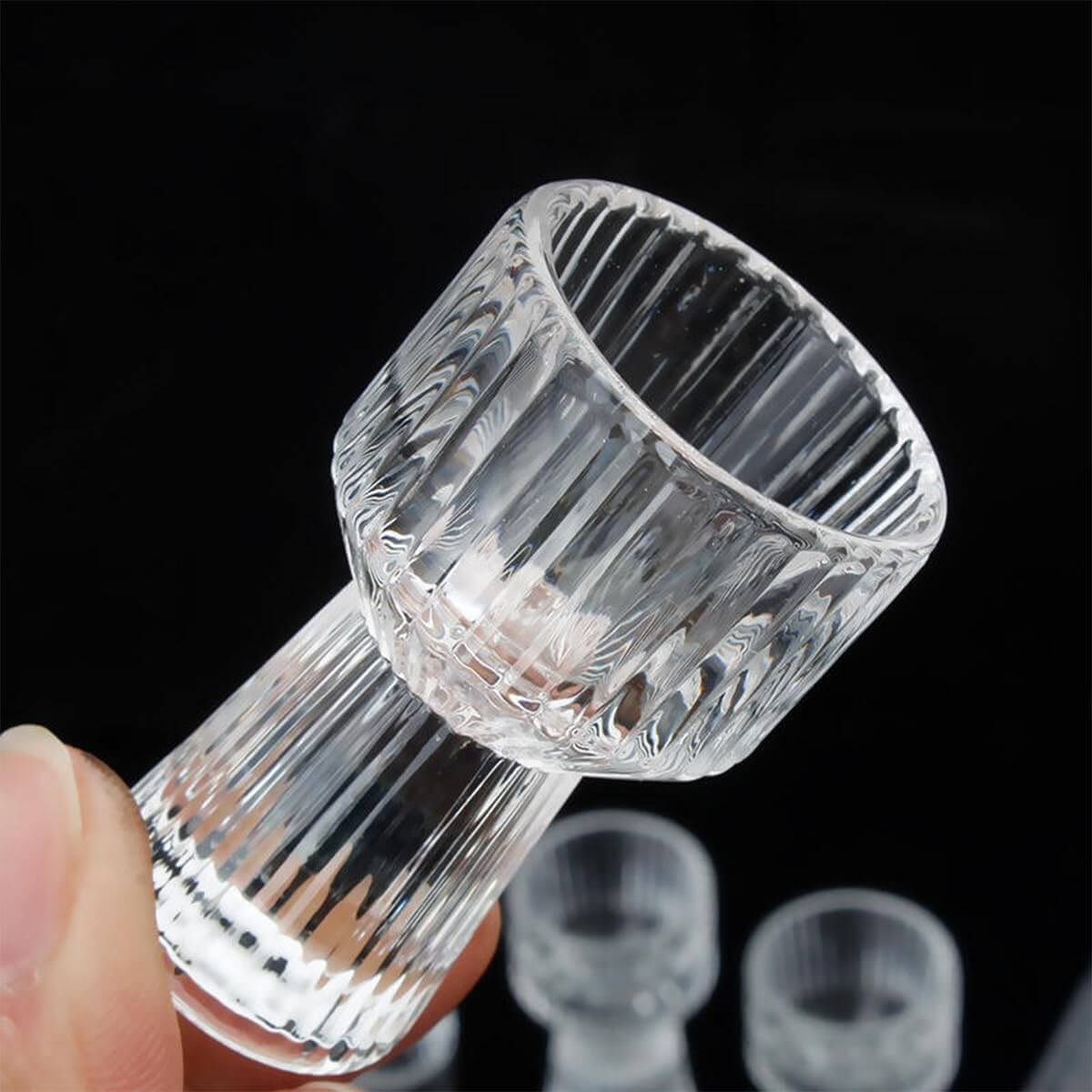 Mini Measure Shot Glass with ribbed sides held by fingers