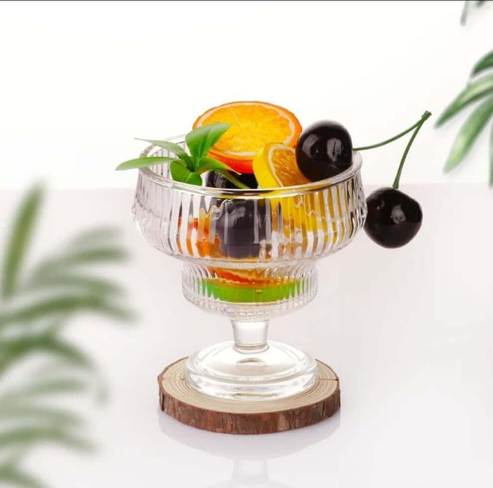 Chilled pudding in a sundae bowl with fruit garnish