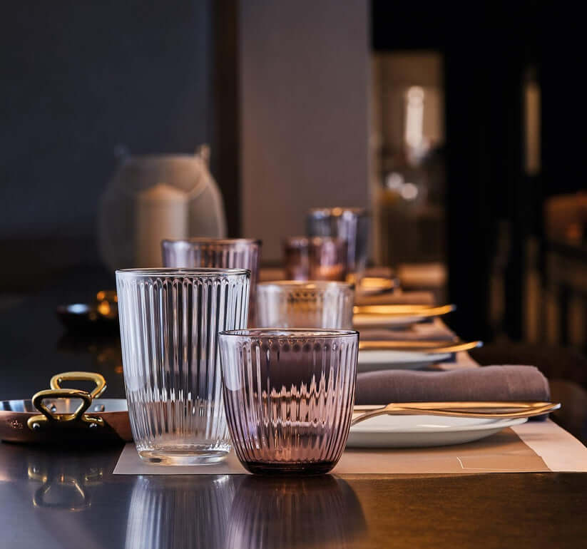 Water pouring into Retro Striped Glass Cup clearly