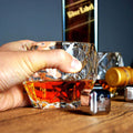 Classic table setting with Diamond Shaped Crystal Whiskey Glass beside whiskey stones