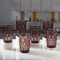 Elegant set of Diamond-Cut Pink Glass tumblers displayed
