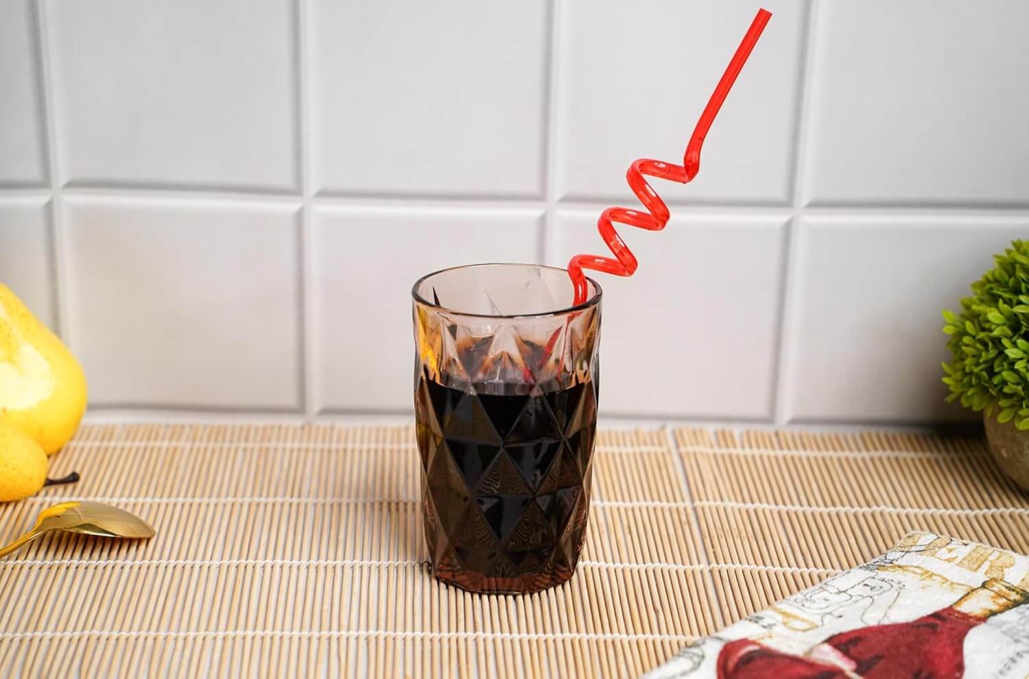 Cola served in Geometric Design Drinking Glasses with twist straw
