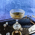 Vintage Crystal Champagne coupe with dark drink